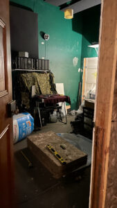 A view of our studio room looking through the new door across to the old one. Most of the gear is elsewhere and there's insulation batts lying all around.